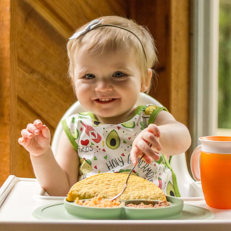 Taco baby Apron for easy mealtime cleanup.