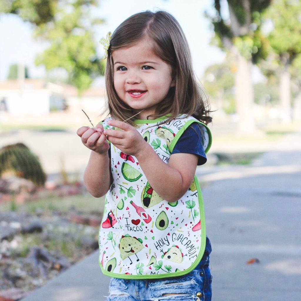 Taco Tuesday baby Apron rinses clean in the sink and makes mealtime fun for littles!